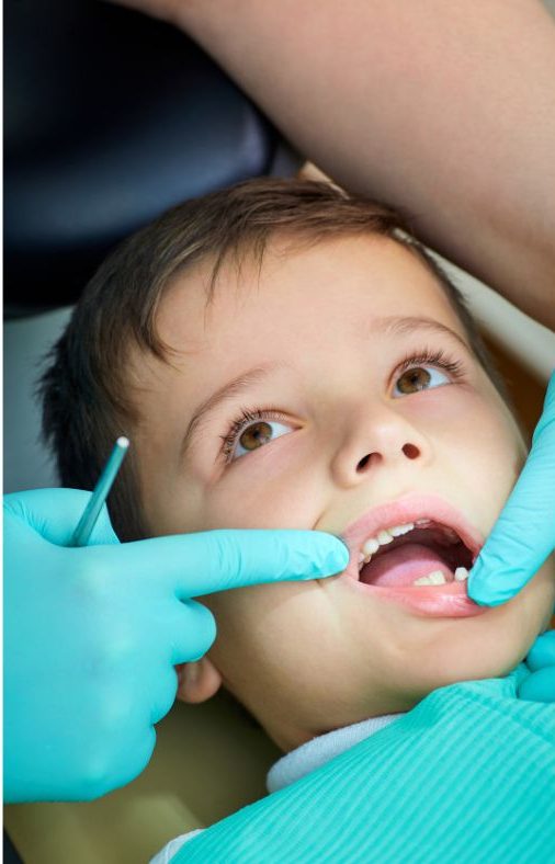 a boy at a dentist