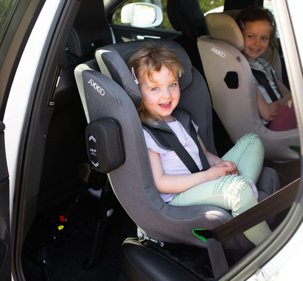 a child in a car seat