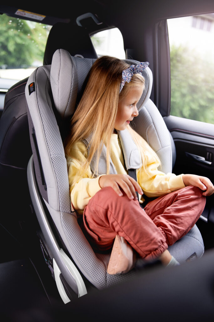 a child in a car seat